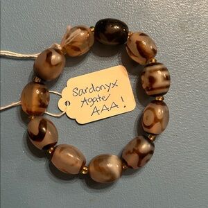 SUPER SARDONYX AGATE Bracelet with tiny beads separating each larger bead.
